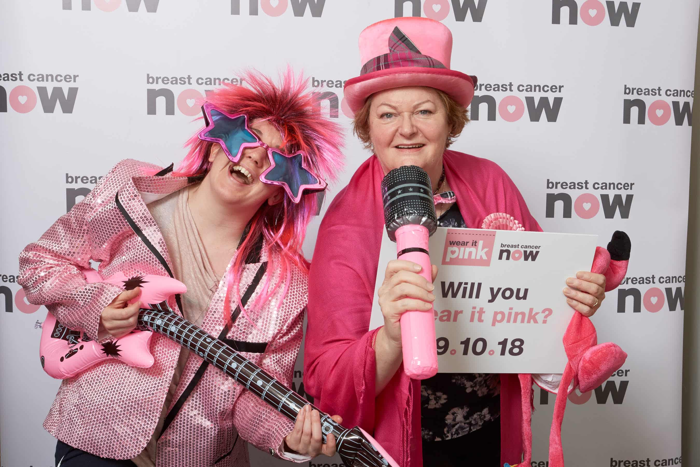Dr Philippa Whitford MP and colleague posing in pink to promote Breast Cancer Now's Wear it Pink day
