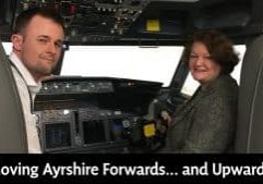 Dr Philippa Whitford, SNP MP for the Central Ayrshire constituency, sitting in a flight simulator at Prestwick Airport. The article relates to the Ayrshire Growth Deal.