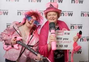 Dr Philippa Whitford MP and colleague posing in pink to promote Breast Cancer Now's Wear it Pink day